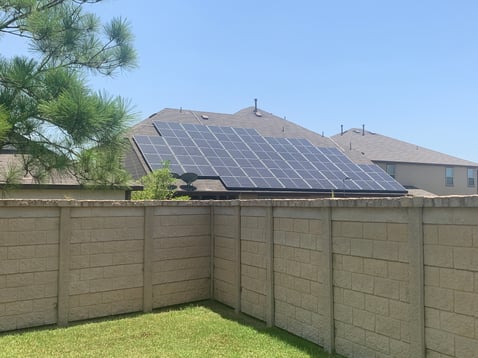 fence and solar panels on roof