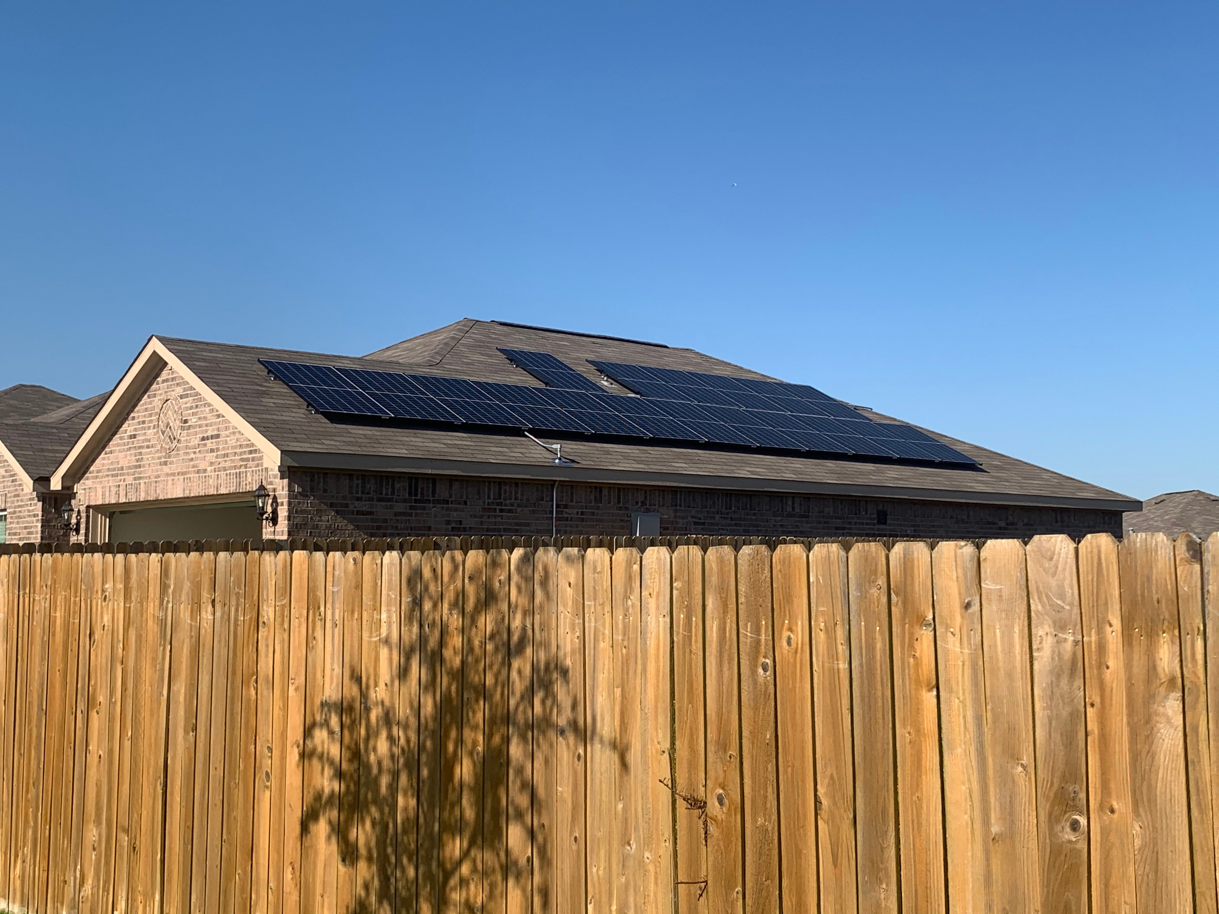 solar panels on roof with fence
